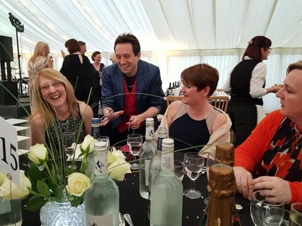 Table magician Matthew Garrett entertaining guests during a corporate dinner