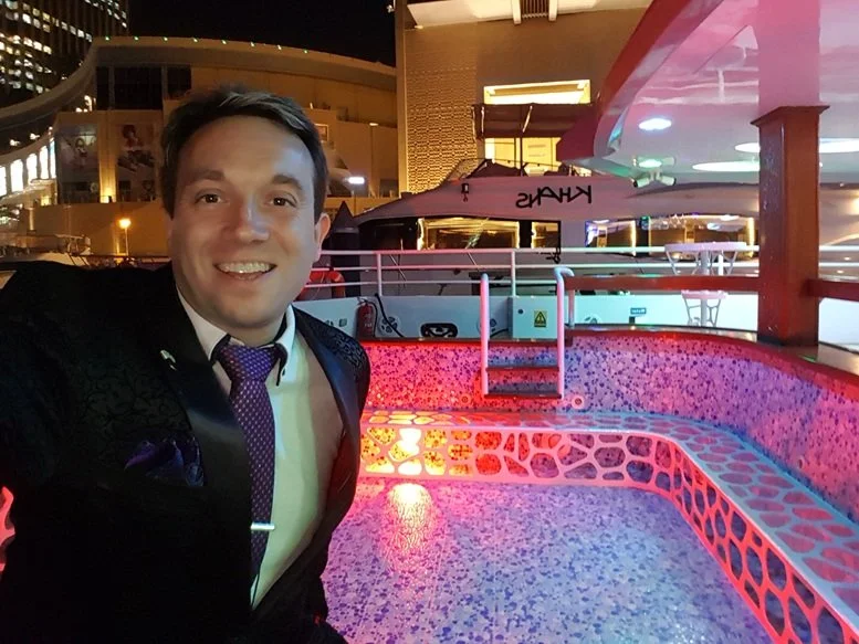 Matthew Garrett aboard a luxury yacht while performing at a private event in Dubai