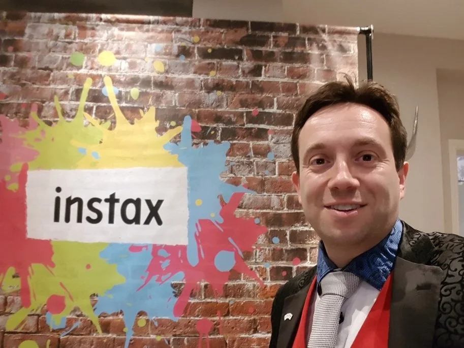 Matthew Garrett performing at an Instax corporate event at Woughton House Milton Keynes