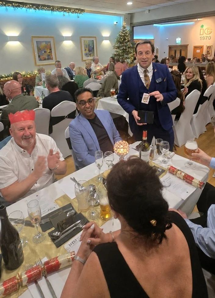 Matthew Garrett entertaining guests at a Christmas function