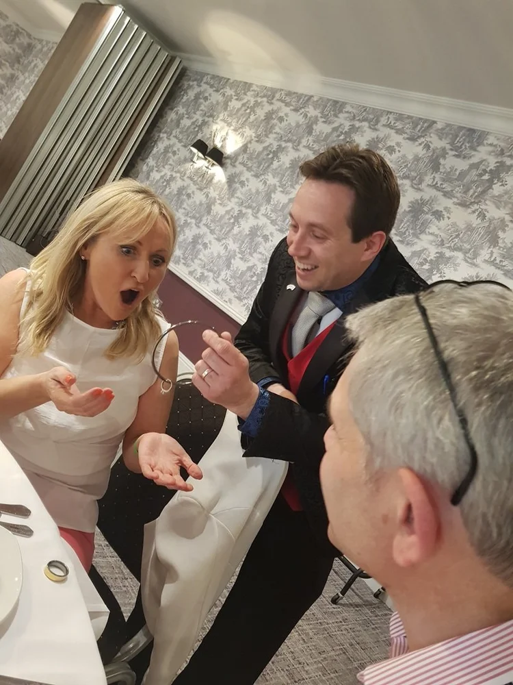 Close-up magic and audience reactions at Woughton House Milton Keynes
