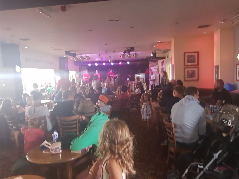 Stage magician Matthew Garrett entertaining an audience at Waldegraves near Colchester