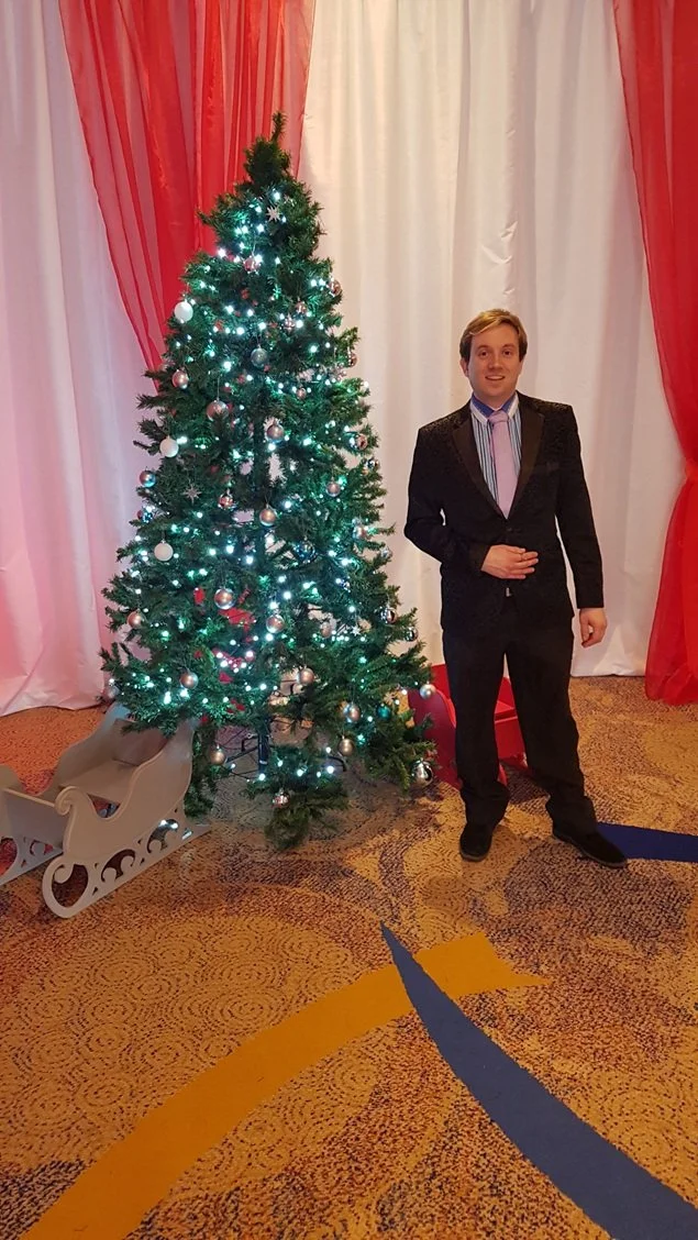 Guests enjoying entertainment at a Christmas party
