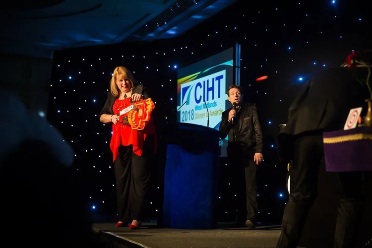 Matthew Garrett performing at a corporate awards event in Birmingham