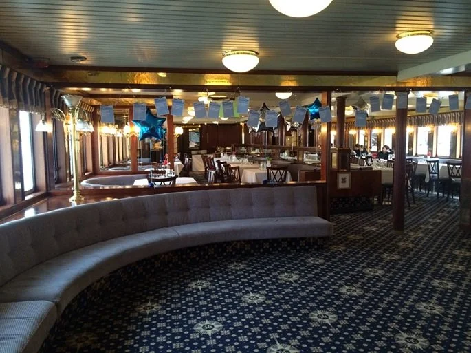 Matthew Garrett performing close-up magic on a London River Thames cruise