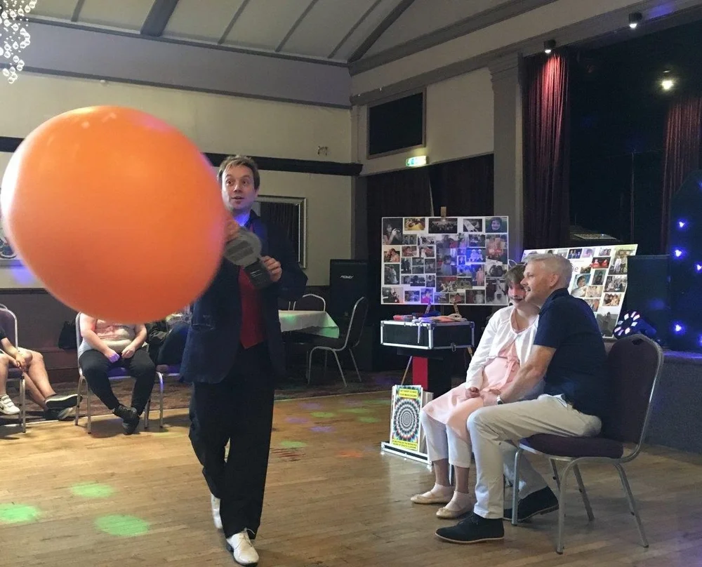Matthew Garrett performing stage magic at The Raven Hotel in Corby