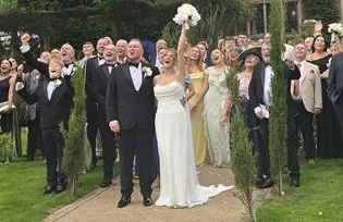 Wedding guests celebrating together at Moxhull Hall