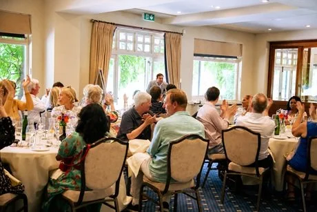 Matthew Garrett performing close-up magic at a birthday celebration at Wimbledon Golf Club London