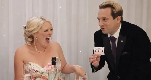 Wedding guests reacting to close-up magician Matthew Garrett