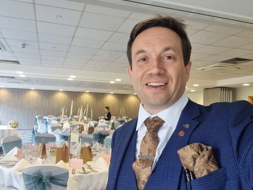 Guests enjoying close-up magic at an Oxford wedding