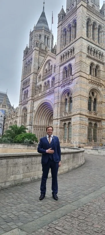London magician Matthew Garrett performing at an event at the Natural History Museum London