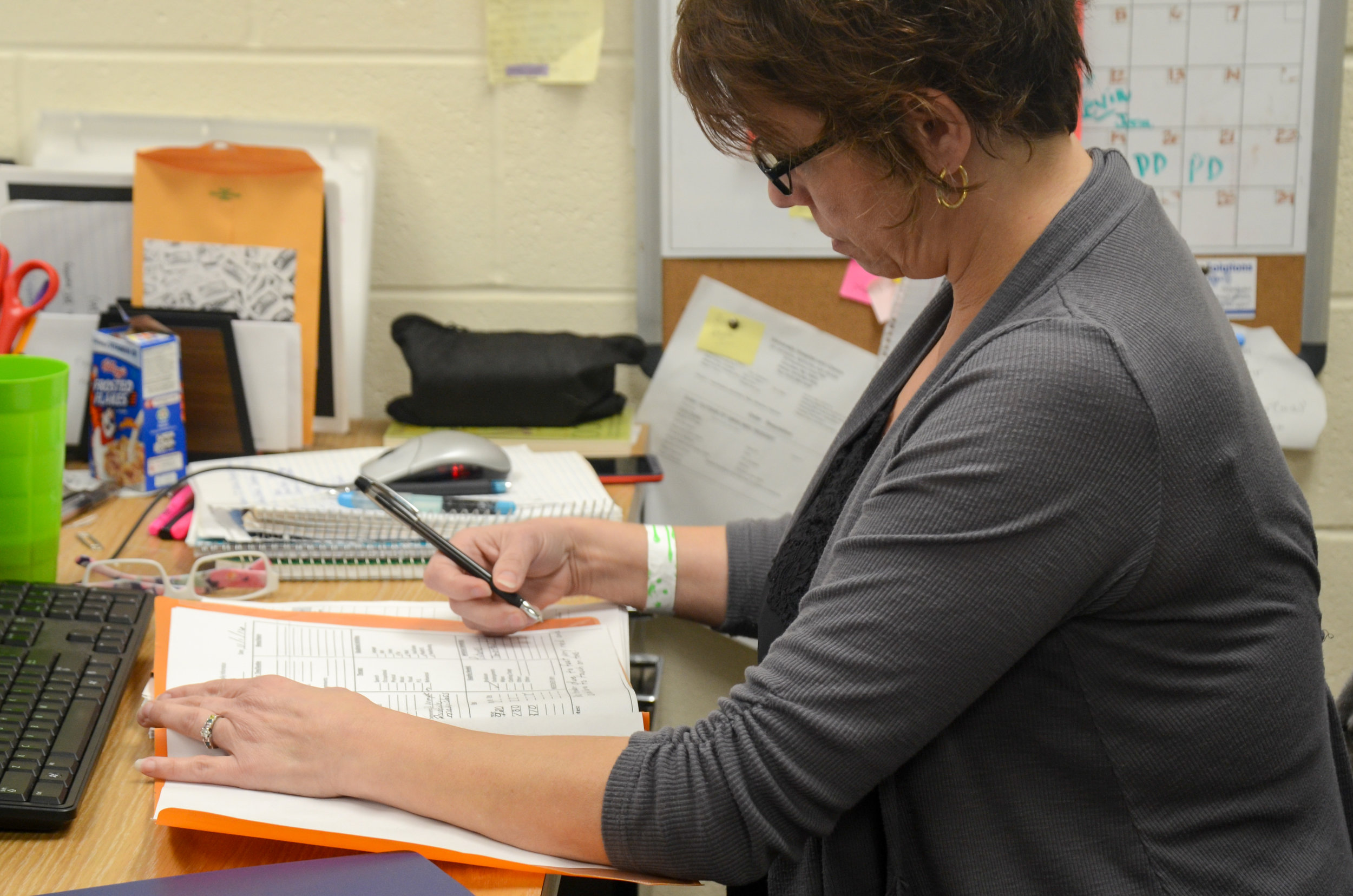   Debbie Muro, a teacher at Delmar Cobble School for the Severely Disabled, records the time when she changes her students’ diapers in Columbia, Missouri, on Tuesday, Nov. 1, 2016. Muro said she does a lot of paperwork in order to provide proper care