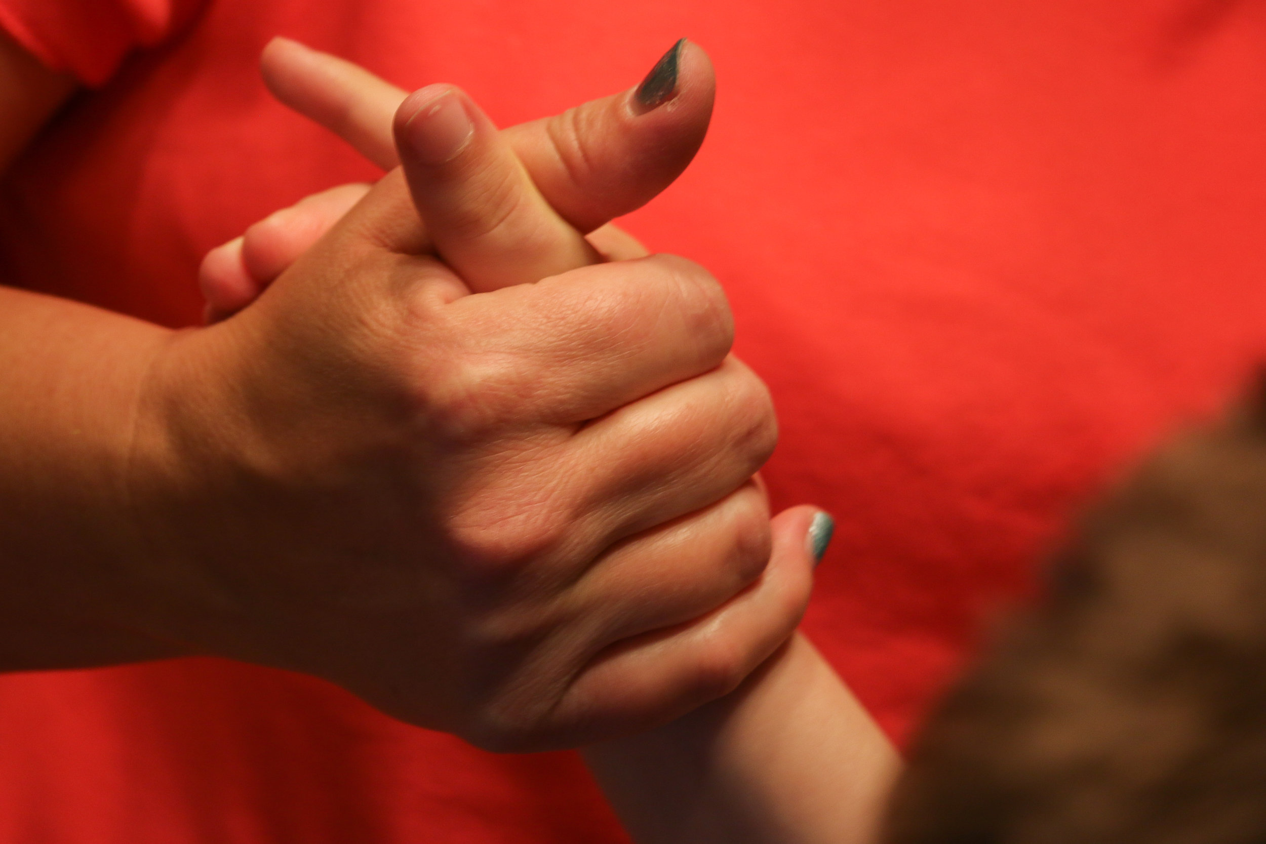   Gretchen Hein-Roberts holds her 12-year-old son Blake’s hand in Columbia, Missouri, on Monday, Oct. 31, 2016. Gretchen said that she is frustrated by high turnover at Delmar Cobble School for the Severely Disabled.   