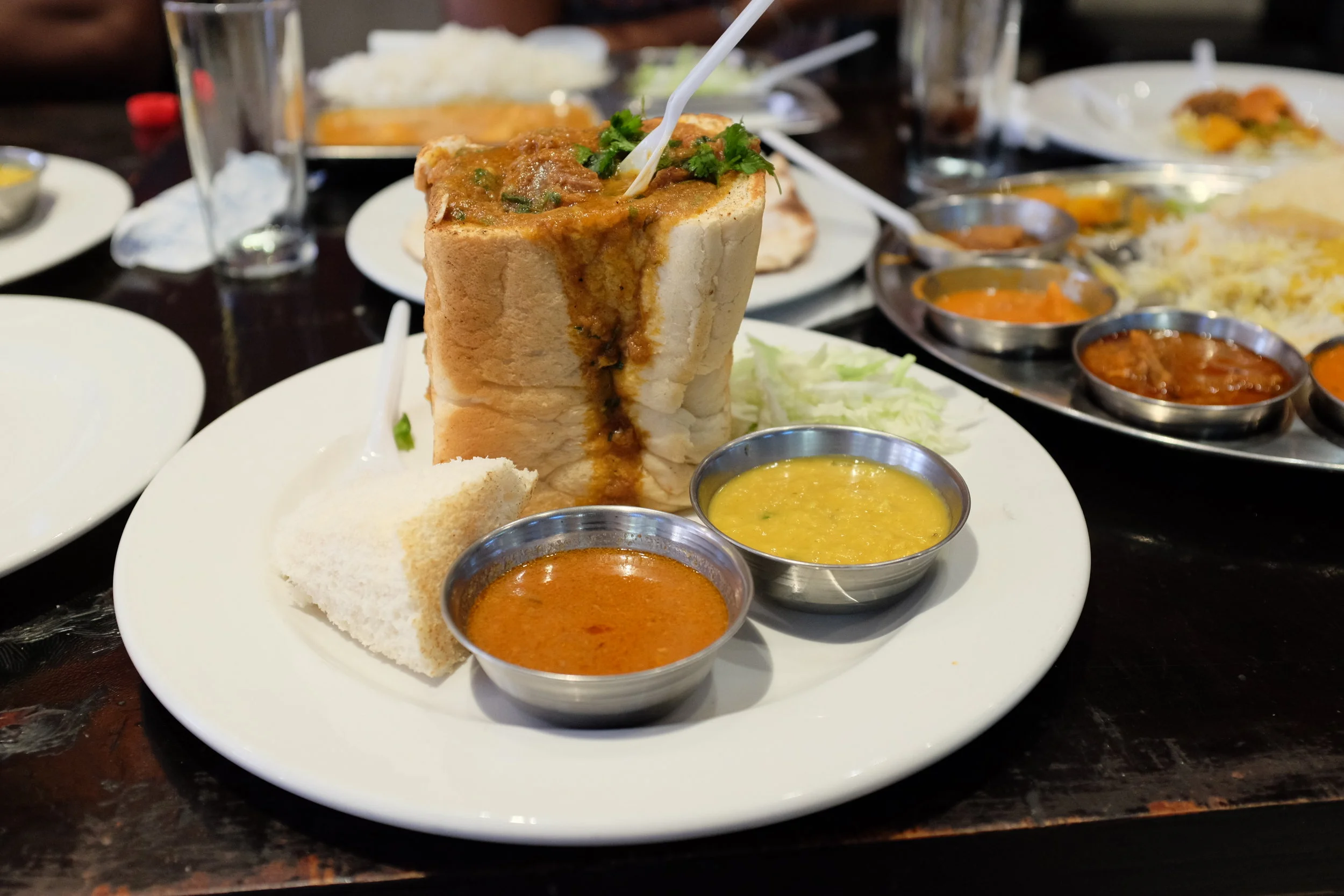 My first bunny chow in Cape Town! Along with dal and gravy.&nbsp;