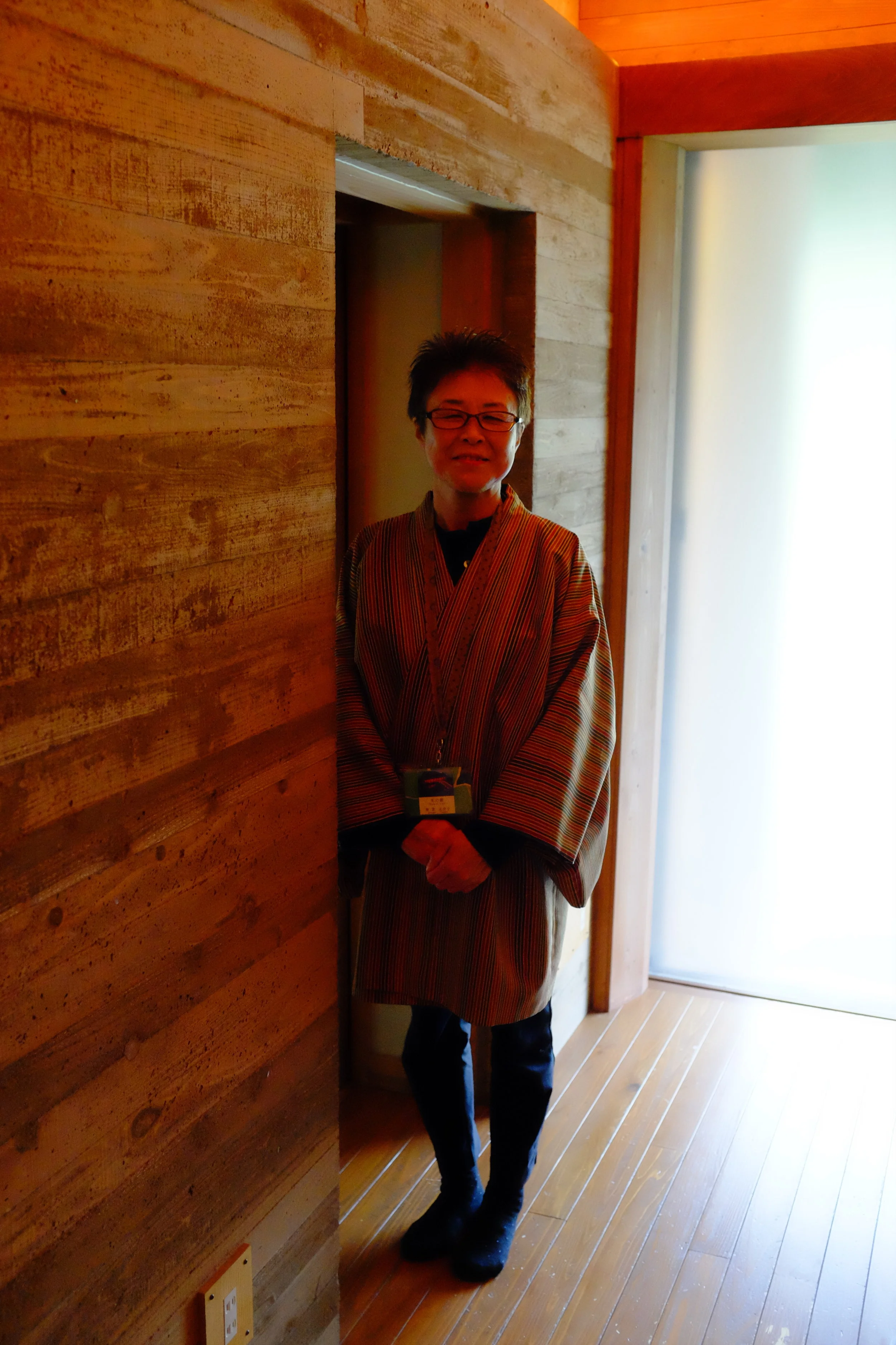 Our guide standing outside an illuminated doorway.