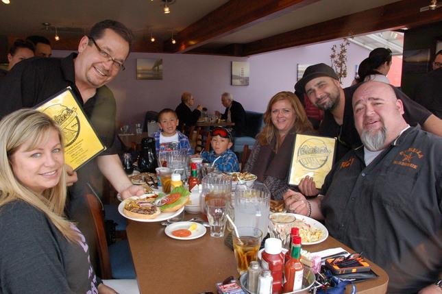 Photo by Horace Hinshaw Breakers restaurant recently opened in Rockaway Beach. Owners Steve Bancroft (left) and Ray Geith, right, greet cutstomers (l-r) Michelle Blagrove, Fallyn Lucia, Paulie Lucia, Stacey Spalding and Rich Bacchi at a morning breakfast.