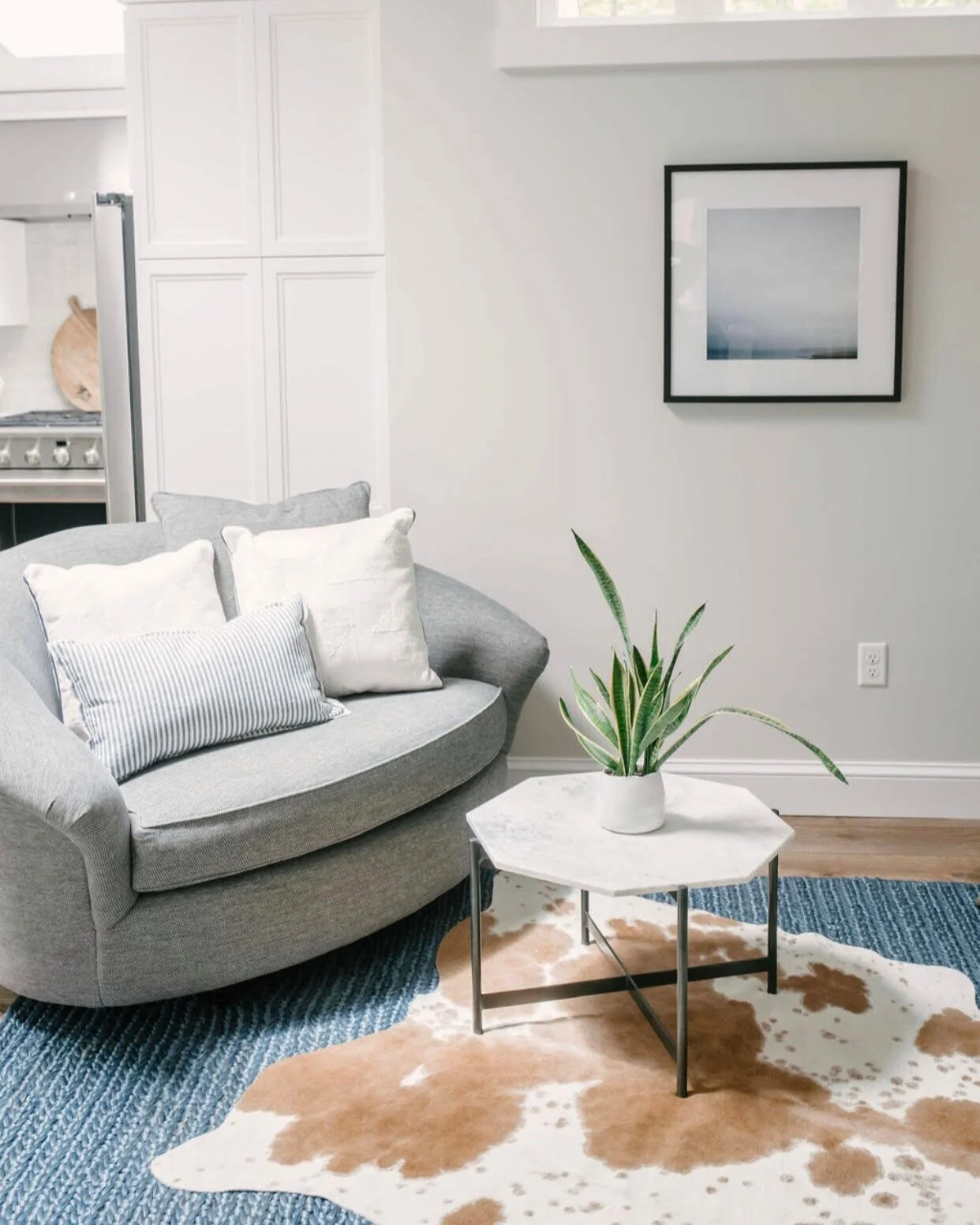 Design by Stamm and Black RUGS... There is a way to successfully layer up rugs without it feeling too cluttered. Try laying a flat weave or jute area rug down first, followed by a smaller cowhide or white fuzzy rug at an angle over it. This will add instant appeal and dimension to the room, and accentuate whatever coffee table of dining table you have sitting on it.