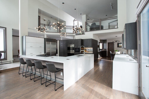 contemporary custom kitchen grey cabinets and white waterfall countertop vaulted ceiling.jpg
