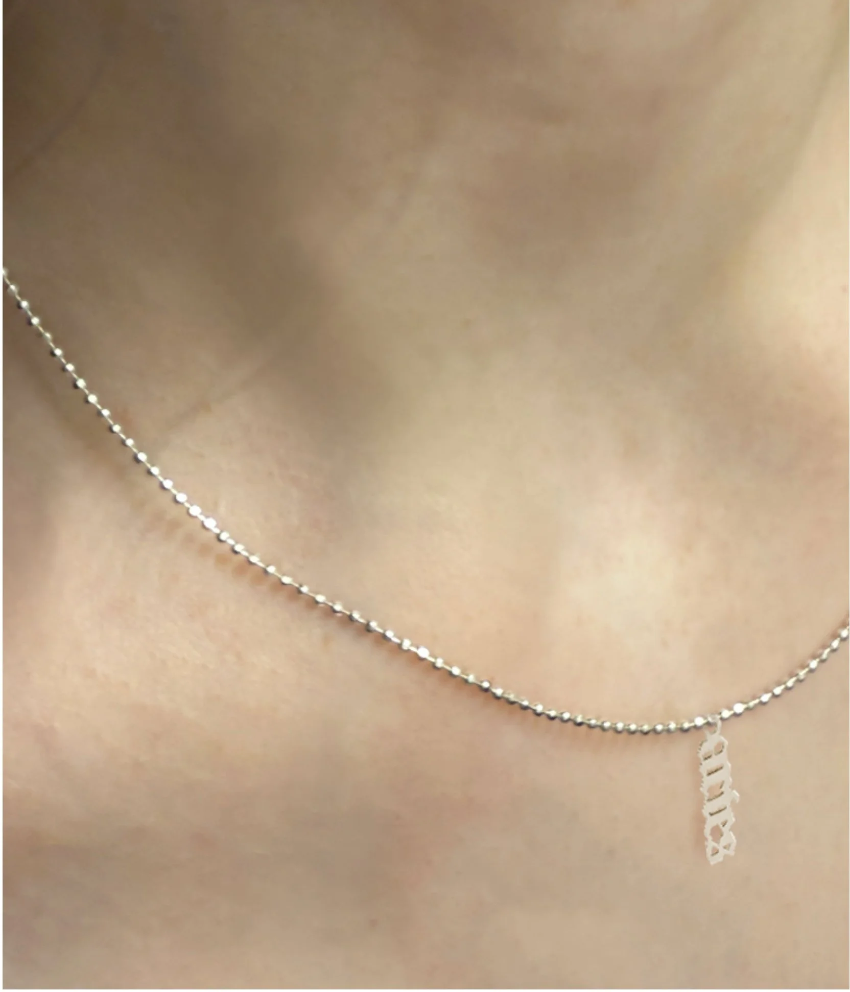 Zodiac Aries Pendant on model.jpg