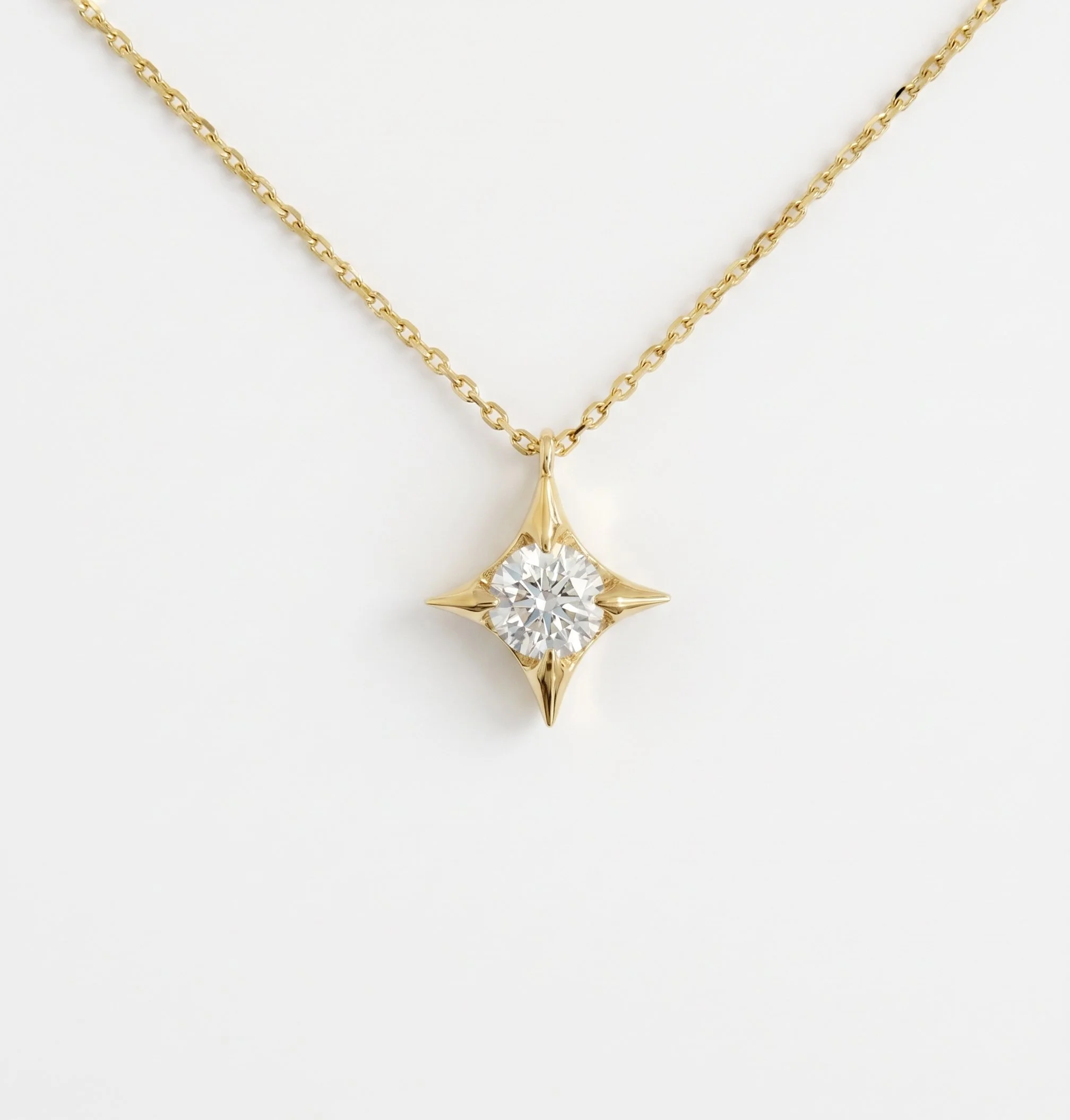 Diamond Four-pointed Star Pendant in 18ct Gold.jpg