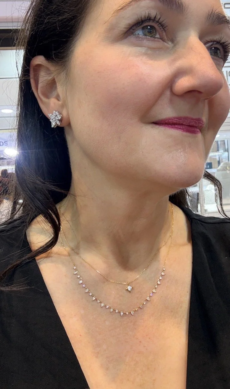 Kirstin Wearing Diamond four-pointed star necklace in 18ct gold.jpg