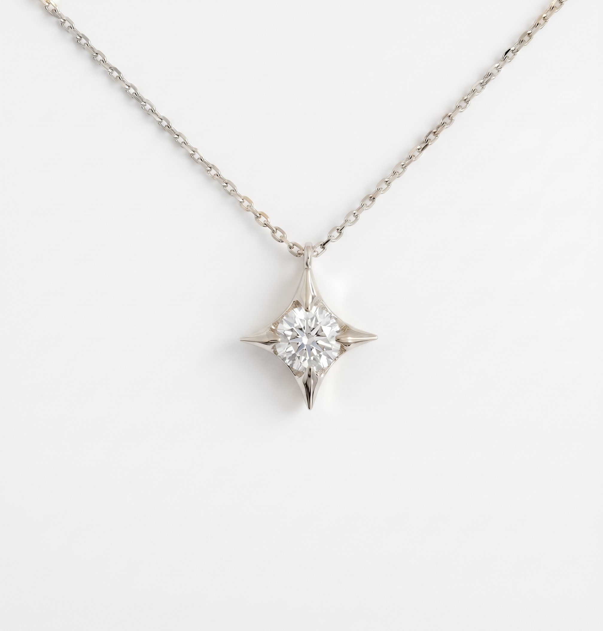 Diamond Four-pointed Star Pendant in 18ct White Gold.jpg