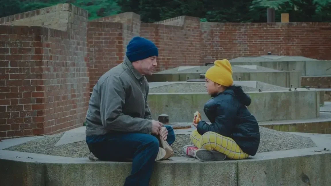 Channing Tatum and Mason Reeves sit outside in the film, Josephine.