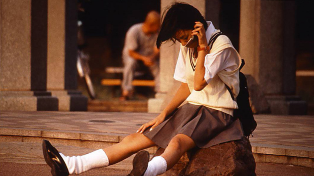 Asumi Miwa sits on the phone in the film 'Love & Pop.'
