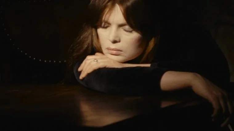 Nico lays her head on her arms in the 1976 film, The Crystal Cradle.