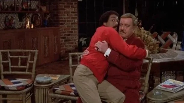 Jack (Pryor) clutches onto a solemn faced U.S. Bates (Gleason).