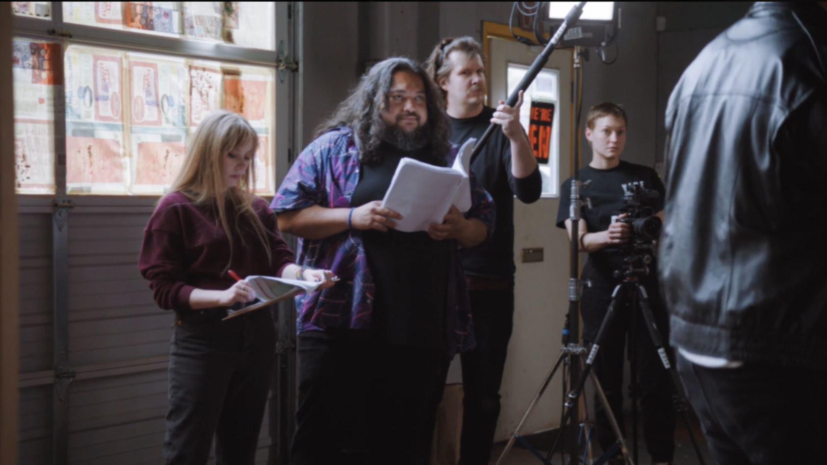 Production Designer Abigail (Abigail Fierce), Adam Pasi, and the rest of the film crew stands together in the movie Skweezy Jibbs Makes a Movie.