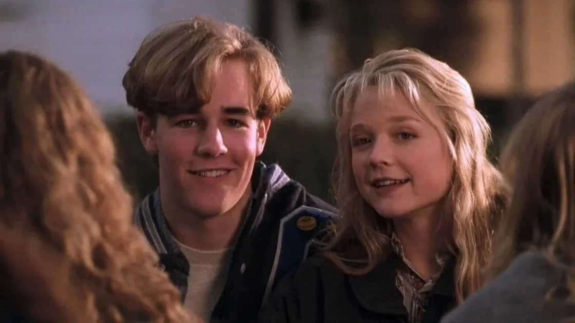 James Van Der Beek as the bully jock Rick Sandford, stands next to Ariana Richards as Melissa Lefevre in the 1995 film, 'Angus.'