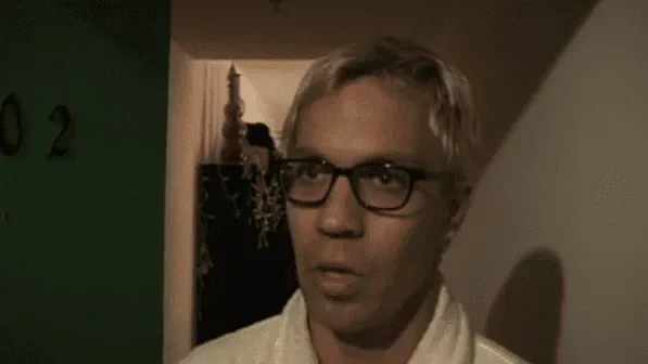 Victor (played by Michael Haboush, the director's brother) speaks with Arthur outside his apartment.