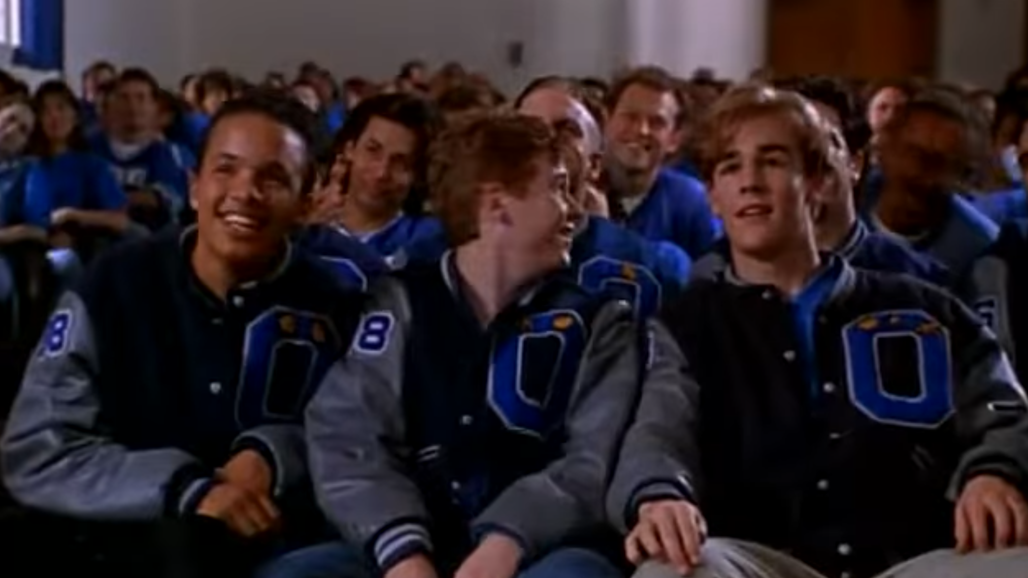 James Van Der Beek as the jock bully Rick Sandford, laughing with his friends at Angus being voted the dance king in the film, 'Angus.'