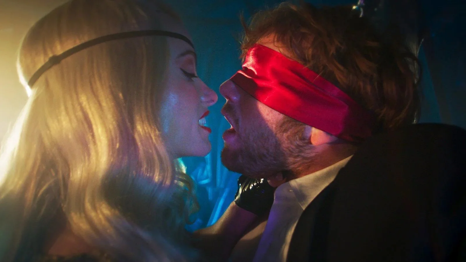 Erika (Olivia Wilde) holds a blindfolded Elliot (Cooper Hoffman) in the film I Want Your Sex.