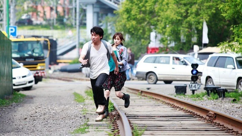 Atsuko Maeda and Ryohei Suzuki in Seventh Code.