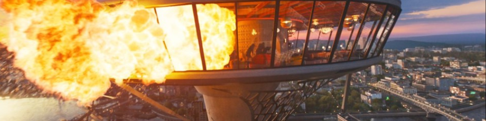 A futuristic building, high up in the sky, explodes in a ball of flame in Final Destination: Bloodlines.