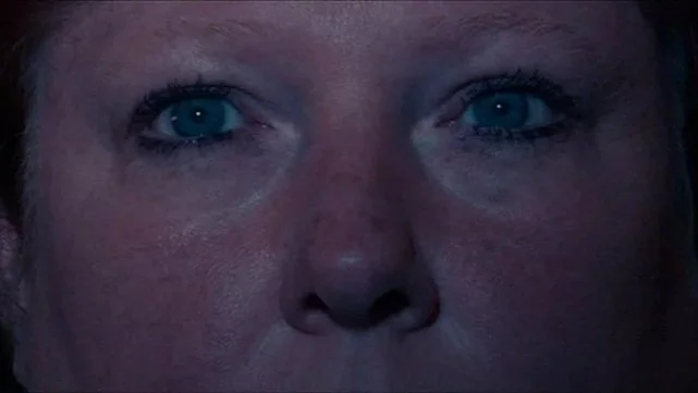An close up shot focuses on Martha's distant blue eyes in Bubble.
