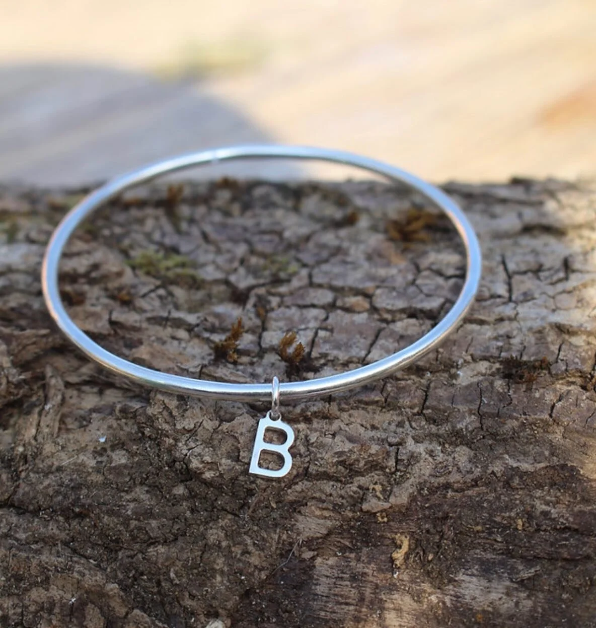 We love the simplicity and elegance of this personalised letter bangle by B-Jewellery