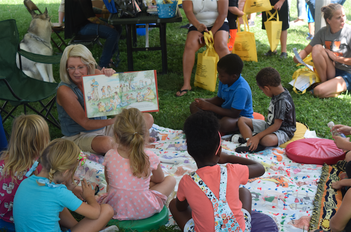 A Huntington woman reads to a group of children as part of the KidsFest theme "Healthy Minds, Healthy Bodies, and Healthy Futures."