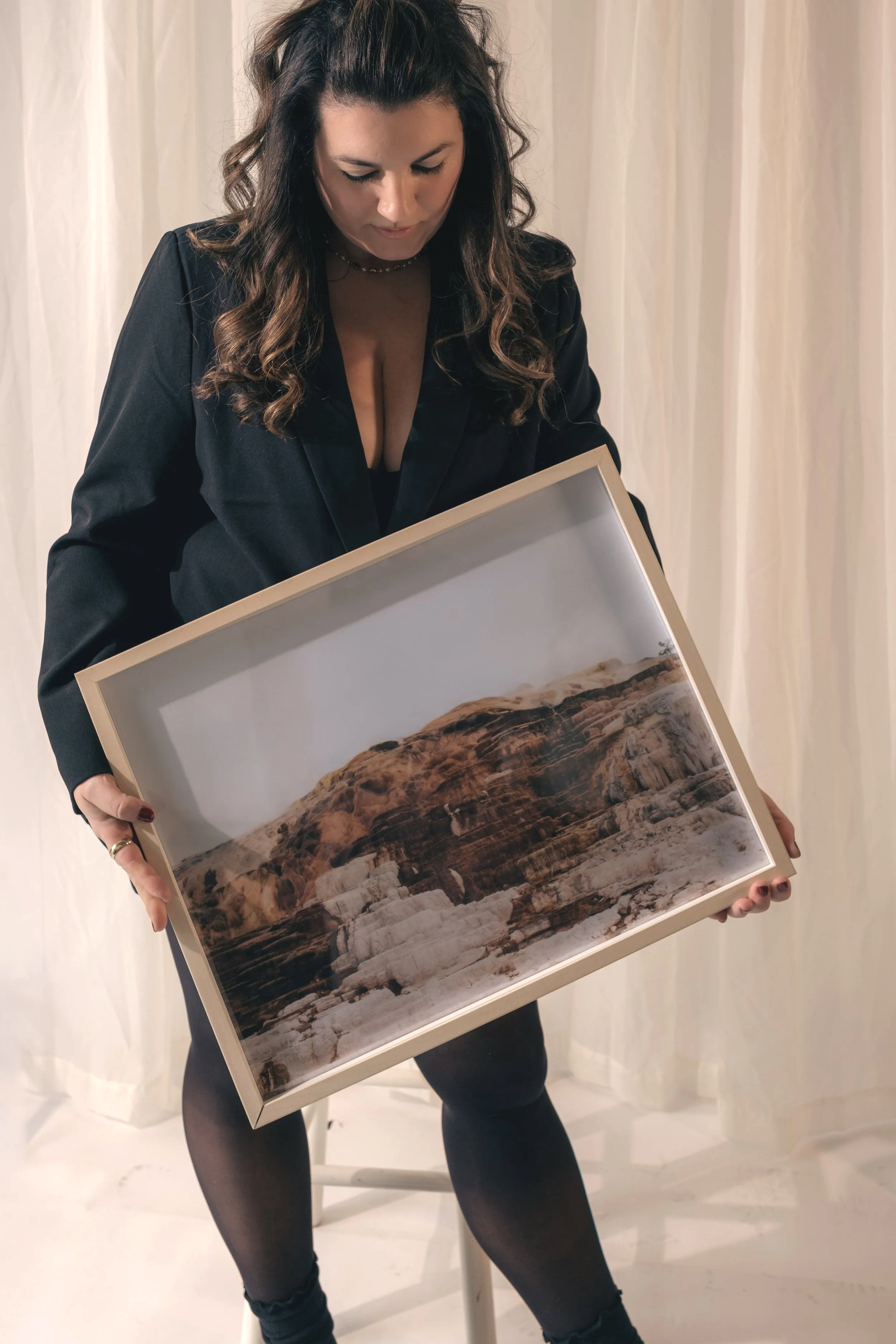 Portland artist Britt Vasina with fine art prints.