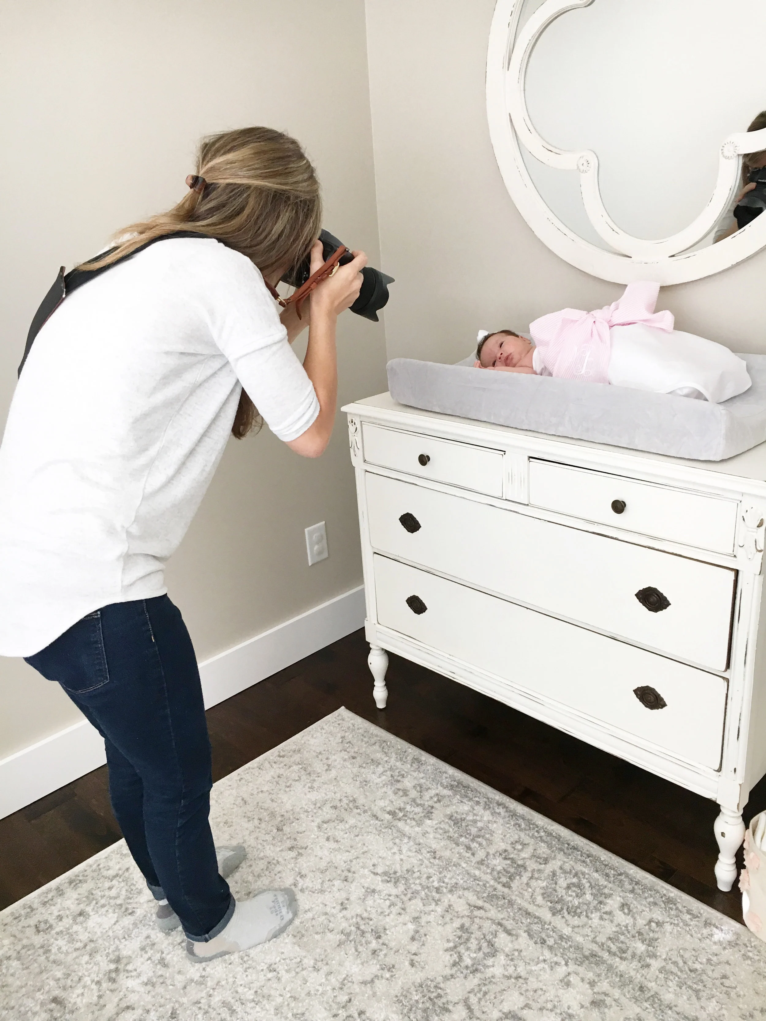 Megan snapped this behind-the-scenes shot! can you see why I love my job?! I get to stare at cute babies all day!!! (And let's take a moment to notice that I'm wearing matching socks... I call that a win! ;) )