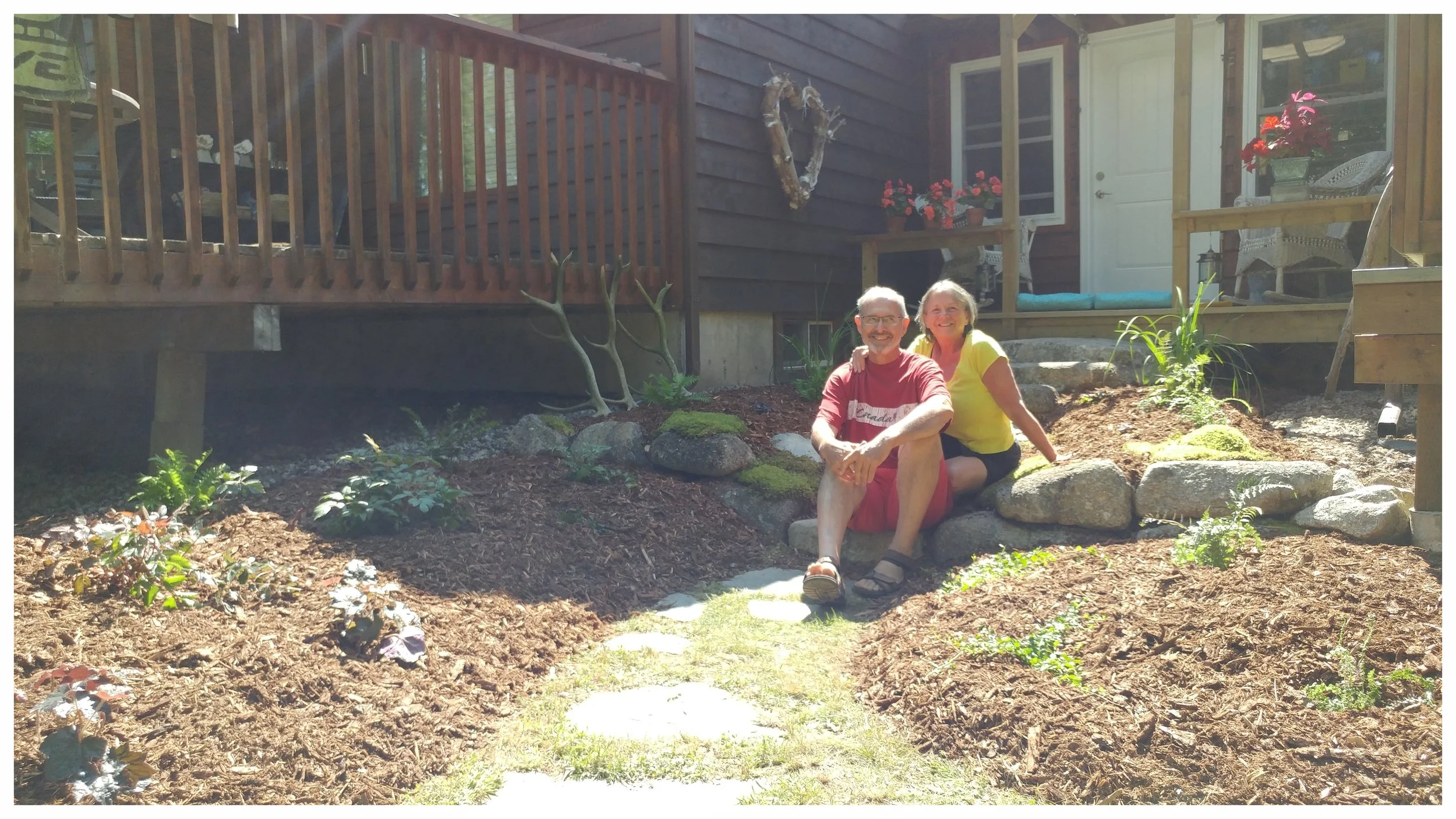 Happy clients in their new ecological garden, created based on a personalized design by Caitlin (Sherbrook Lake, NS).