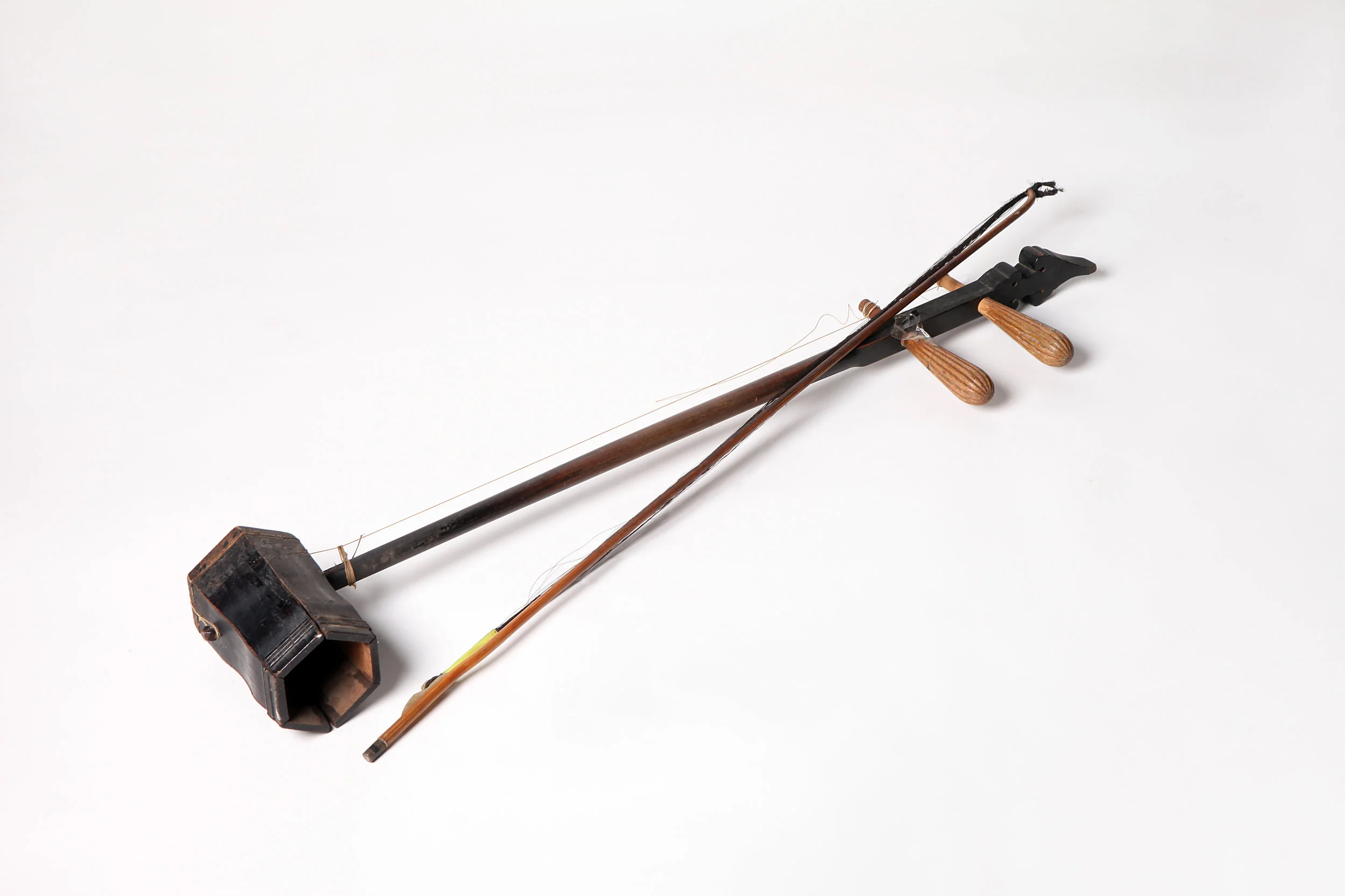 Erhu can be traced back to Tang dynasty over 1000 years ago, known as Xiqin . It is a traditional bowed instrument. Erhu , literally “two-stringed huqin ”, is also known as nanhu (literally “southern huqin ”) or wengzi . It is a major bowed instrument ( caxian instrument) among the Chinese ethnic instruments.