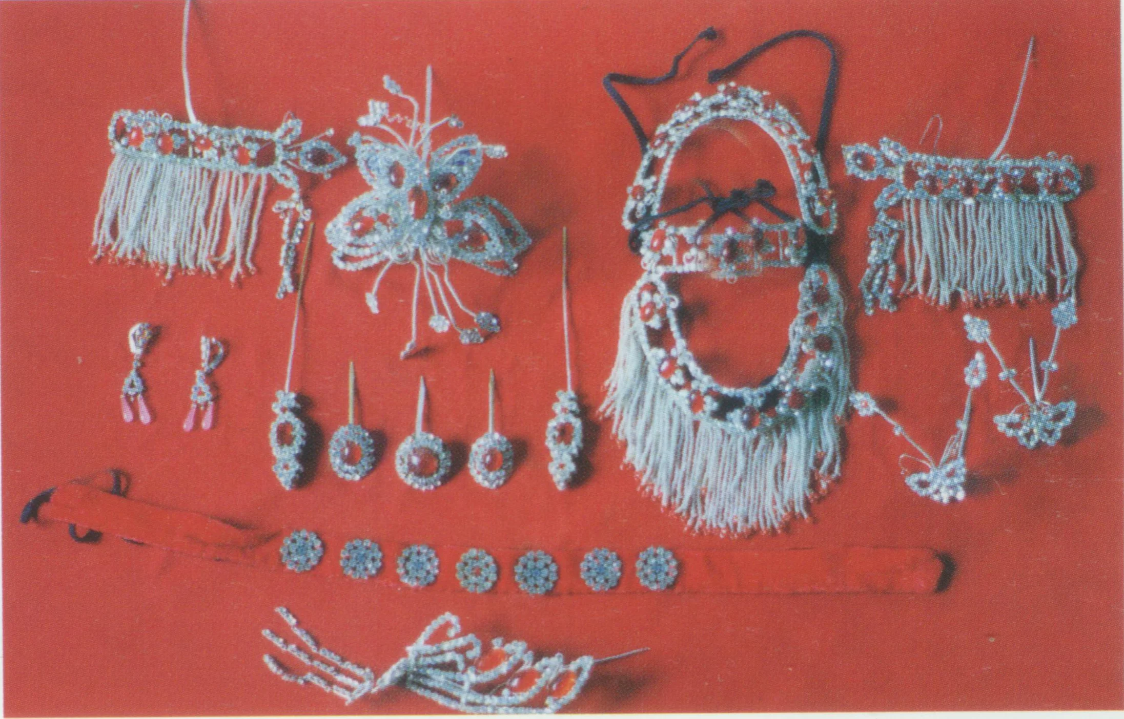 Shuizhuan toumian headdress for Dan role with rhinestones inlayed in a metal base. Shuizhan toumian has the similar components in a set as that of Diancui toumian. Since the headdress looks the most resplendent in all toumian, it is often worn by young beauties with cheerful character.