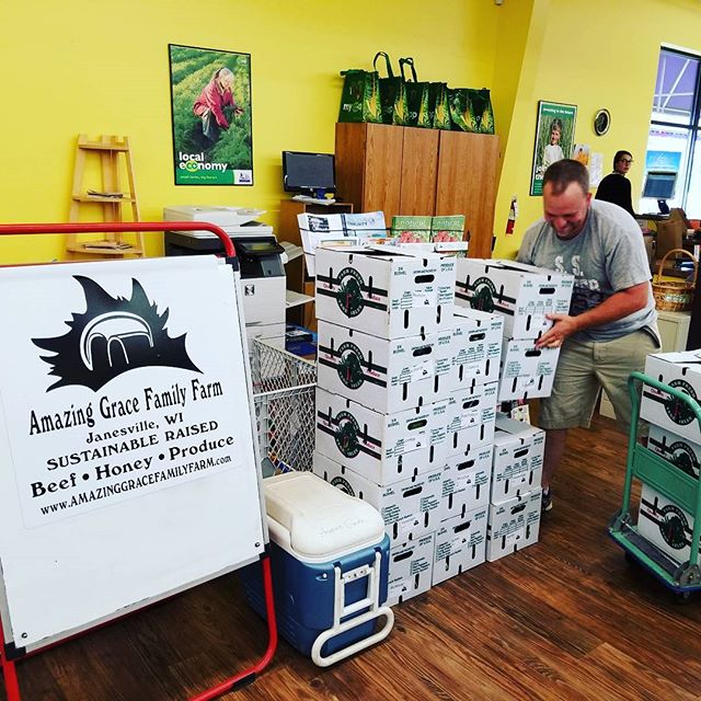 Amazing Grace Chris unloading CSA boxes.jpg