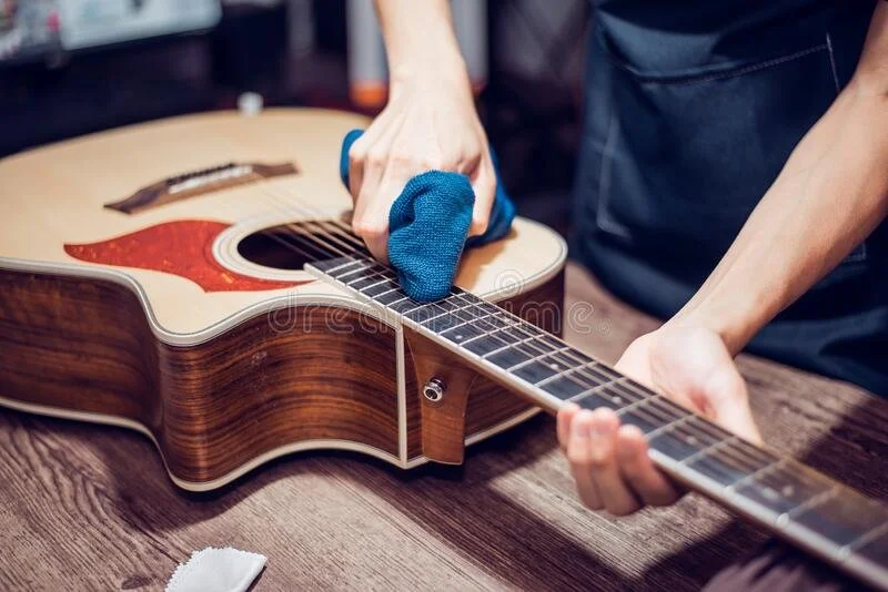 acoustic-guitar-repair-service-acoustic-guitar-repair-service-cleaning-acoustic-guitar-close-up-181058596.jpeg