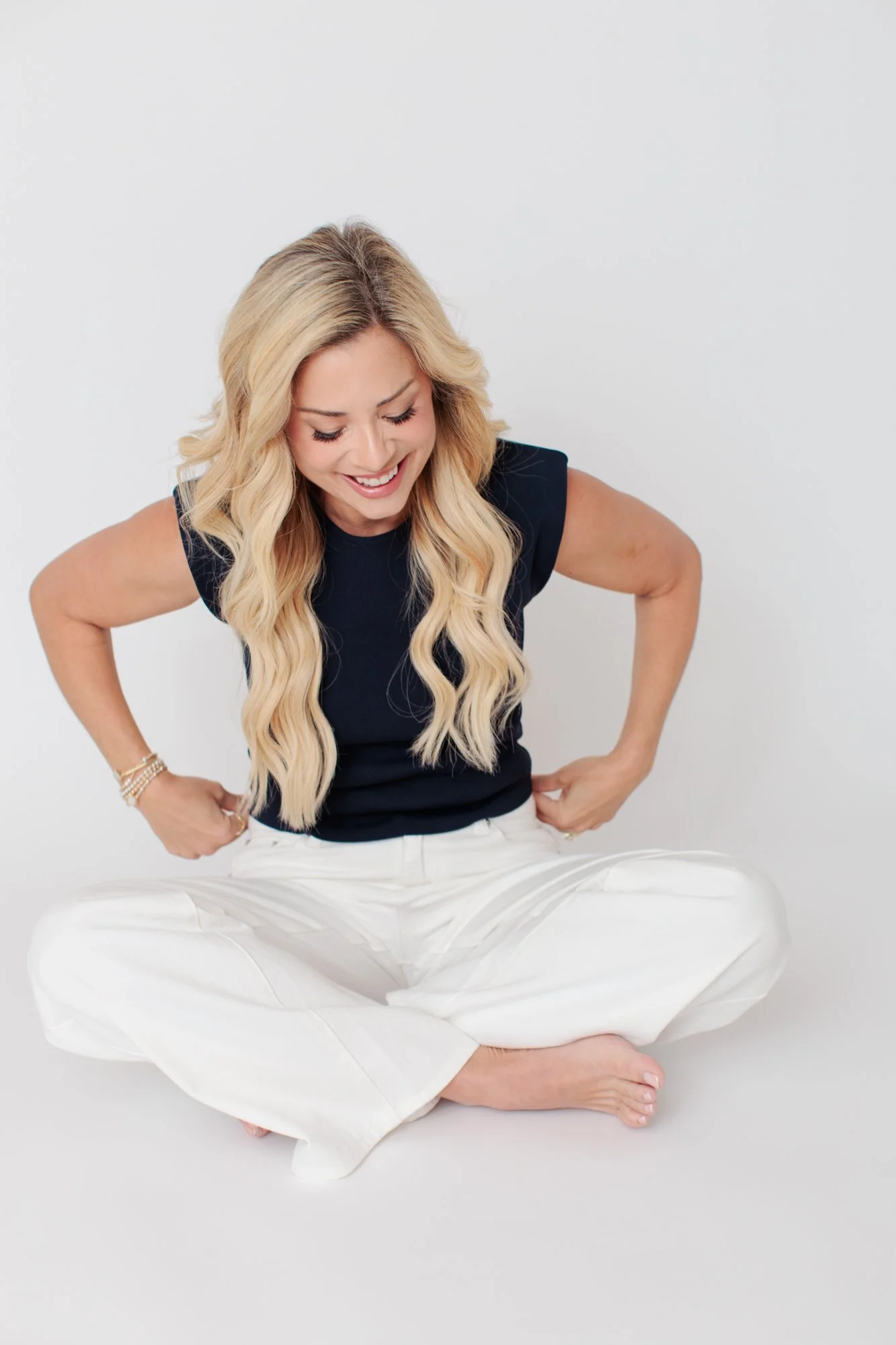 woman laughing and sitting on the floor in SIlver Spring studio