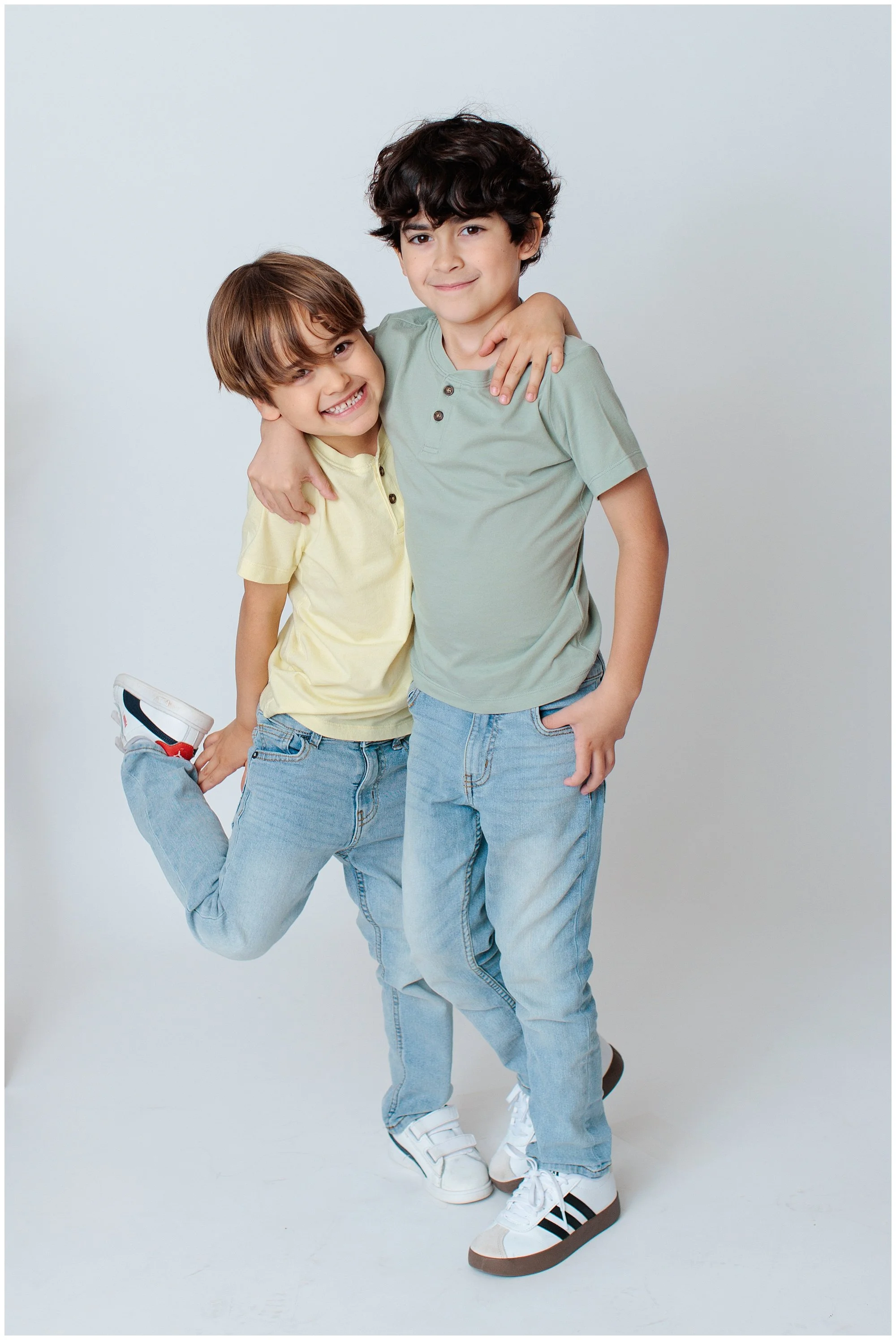 two boys in silver spring studio with white background