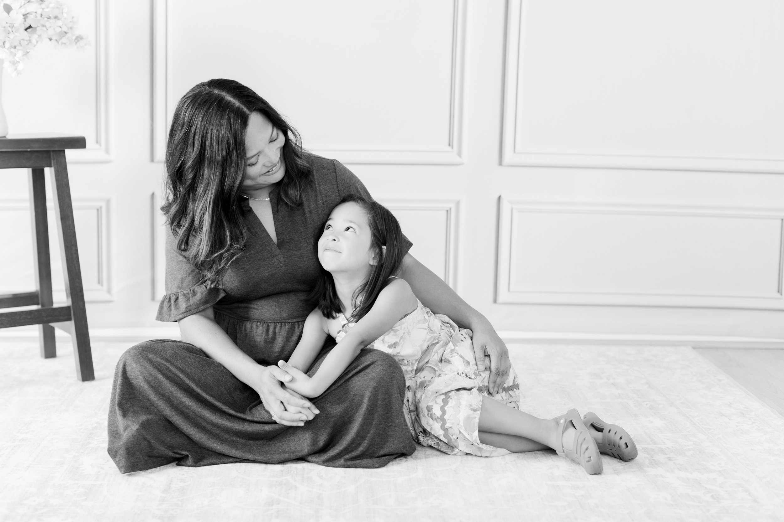 mom and daughter sitting together in Silver Spring studio